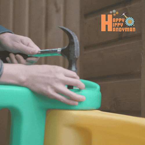 Hammering a plastic component for a children’s playset, highlighting toy assembly skills