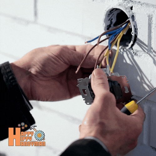 Securing wires in a junction box, showcasing safe electrical practices.