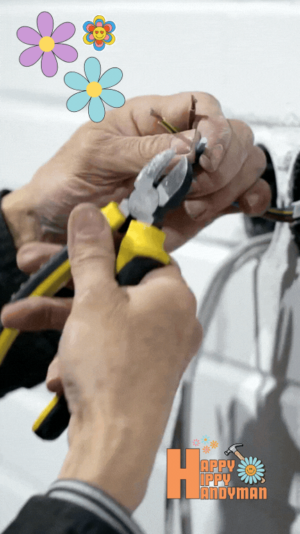 a handyman repairs an electrical issue in a kitchen