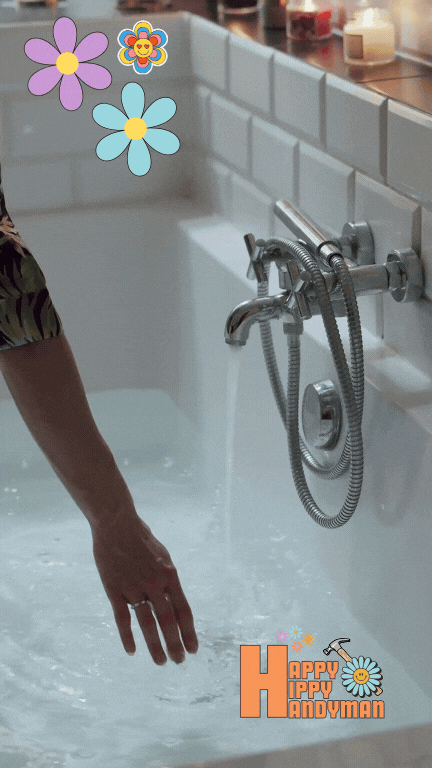 Close-up of a woman's arm turning on the faucet to fill a bathtub, showcasing reliable plumbing fixture performance