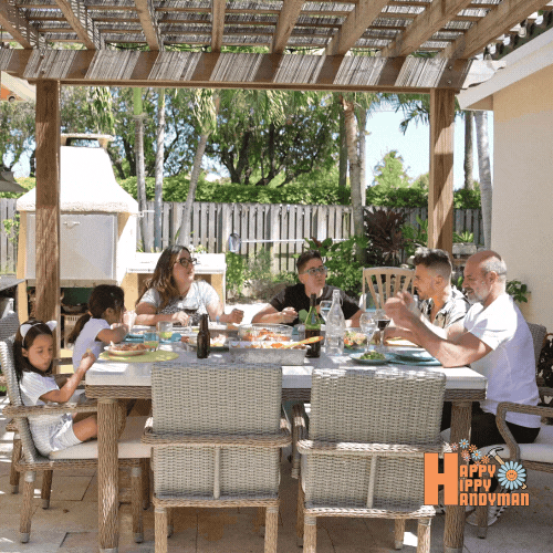 A family gathered around a dining table under a charming pergola, enjoying a meal together in a beautifully designed outdoor space that exemplifies innovative Outdoor Projects.