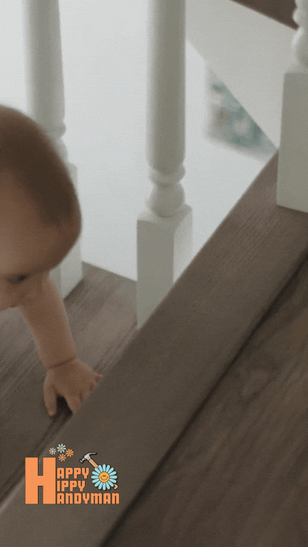 Infant reaching for the next step on a staircase, highlighting the importance of professional baby proofing for stair safety.