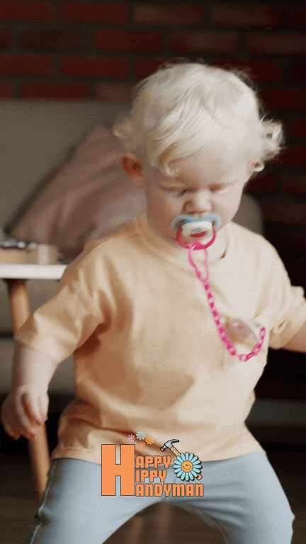 Toddler with a pacifier taking wobbly steps, emphasizing how professional baby proofing creates a safer environment for new walkers